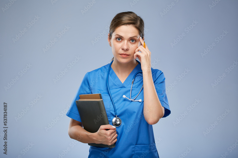 Thinking medical student intern or teacher, doctor woman holding books. Isolated female portrait.