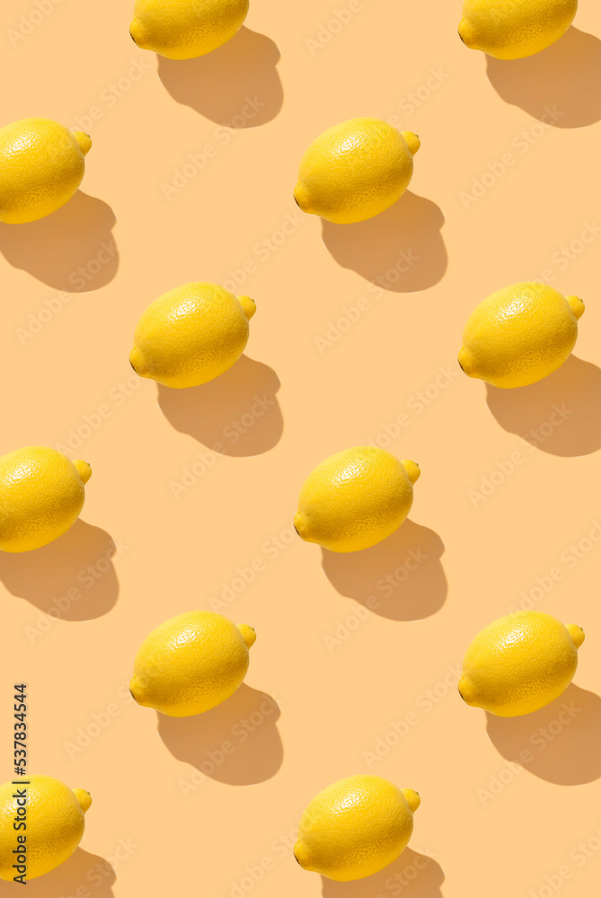Pattern from lemon fruit on yellow pastel soft color background. Design for wrapping paper, fabrics, covers and cards. Pattern for wallpaper, background and textile Pattern from lemon fruit on yellow pastel soft color background. Design for wrapping paper, fabrics, covers and cards. Pattern for wallpaper, background and textile