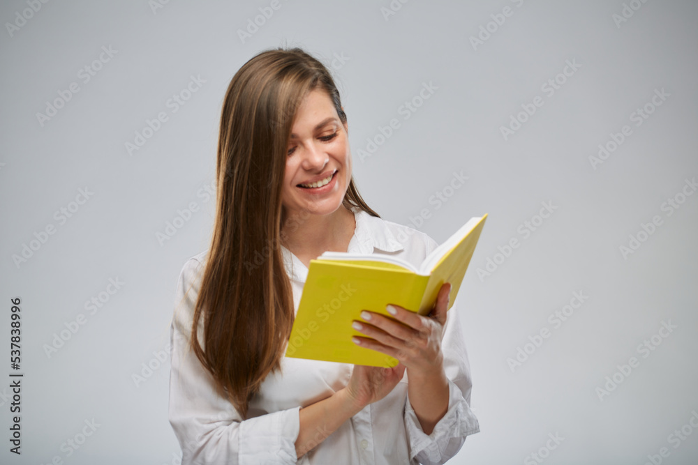 Student or teacher woman reading yellow book, isolated female portrait. Student or teacher woman reading yellow book, isolated female portrait.