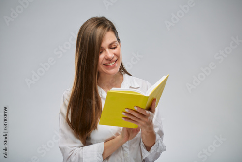 Student or teacher woman reading yellow book, isolated female portrait.