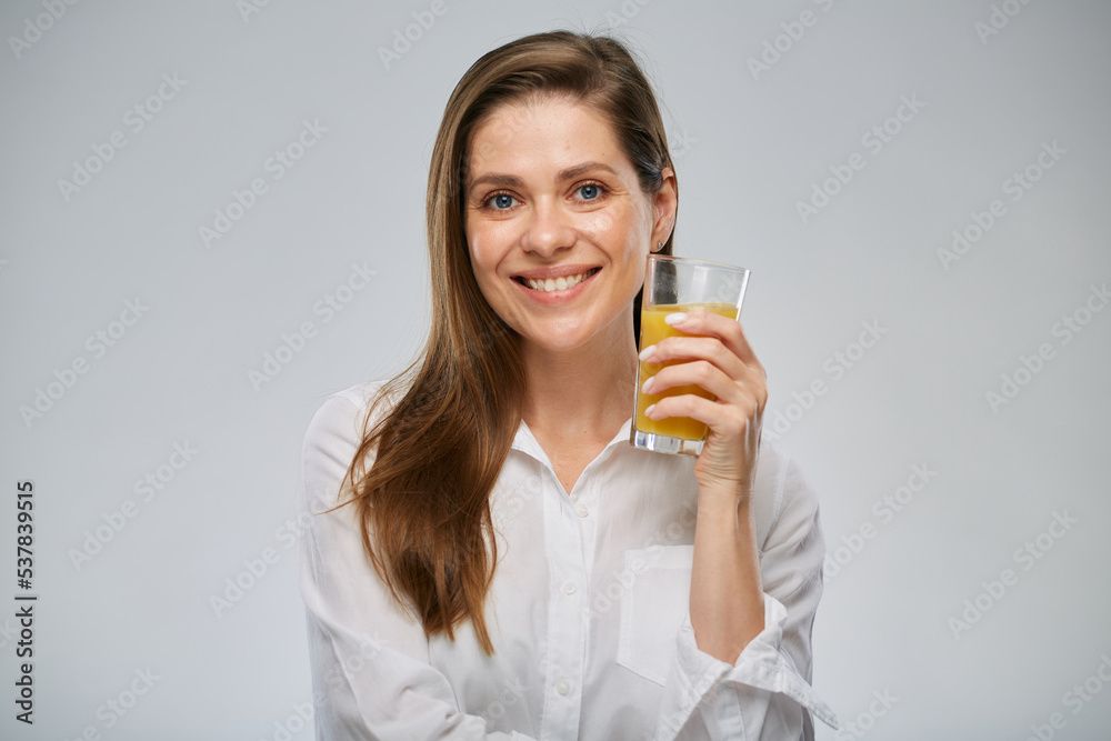 Smiling woman holding orange juice glass. Isolated female advertising portrait. Smiling woman holding orange juice glass. Isolated female advertising portrait.