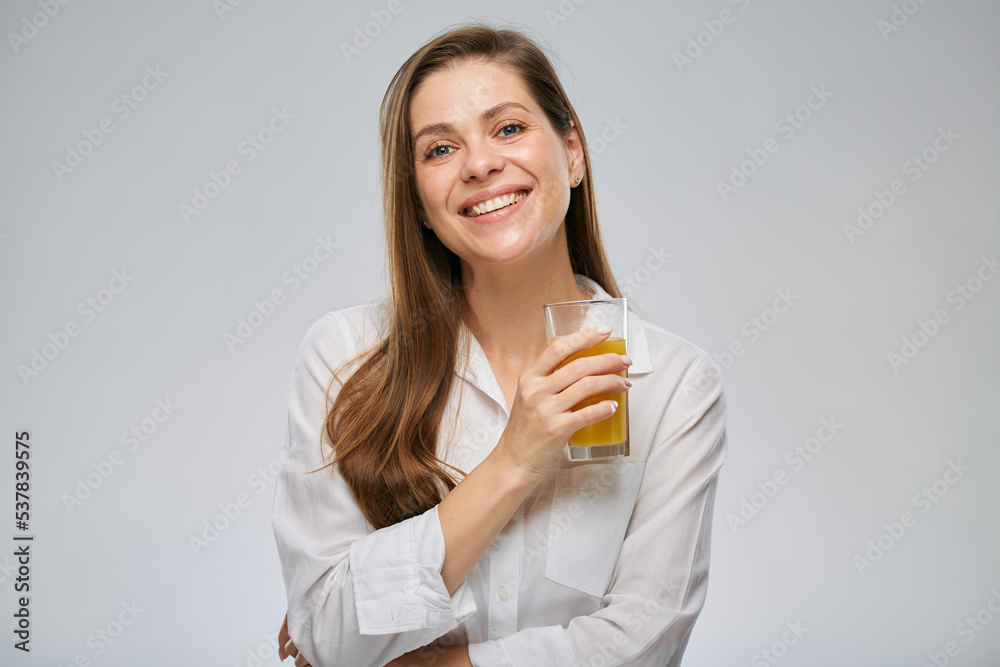 Smiling woman holding orange juice glass. Isolated female advertising portrait. Smiling woman holding orange juice glass. Isolated female advertising portrait.