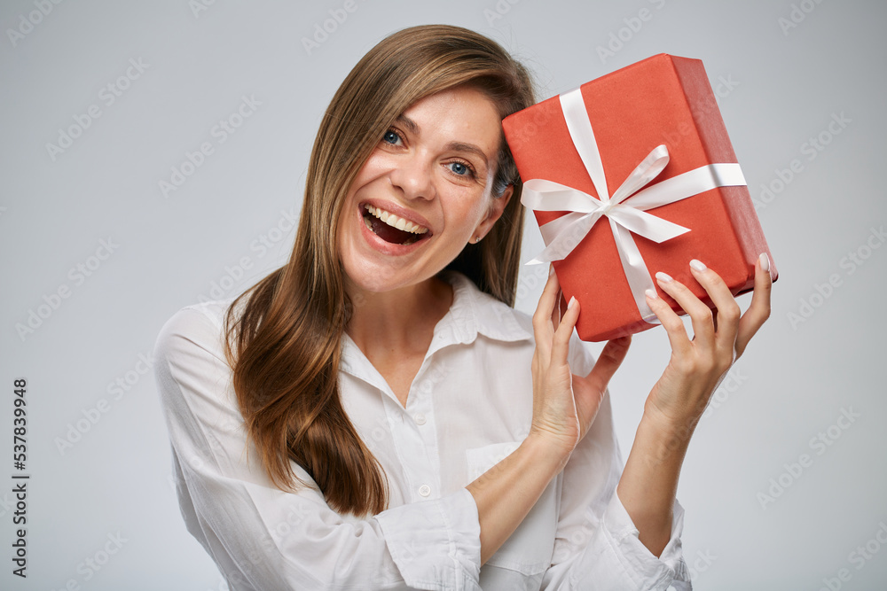 Happy woman holding gift box. Isolated female portrait. Happy woman holding gift box. Isolated female portrait.