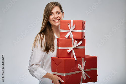 Happy woman after shopping with presents. Isolated female portrait.