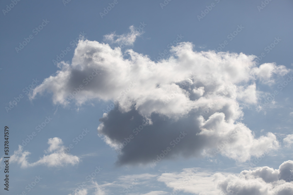Powerfully cumulus white clouds against a blue sky. Powerfully cumulus white clouds against a blue sky.