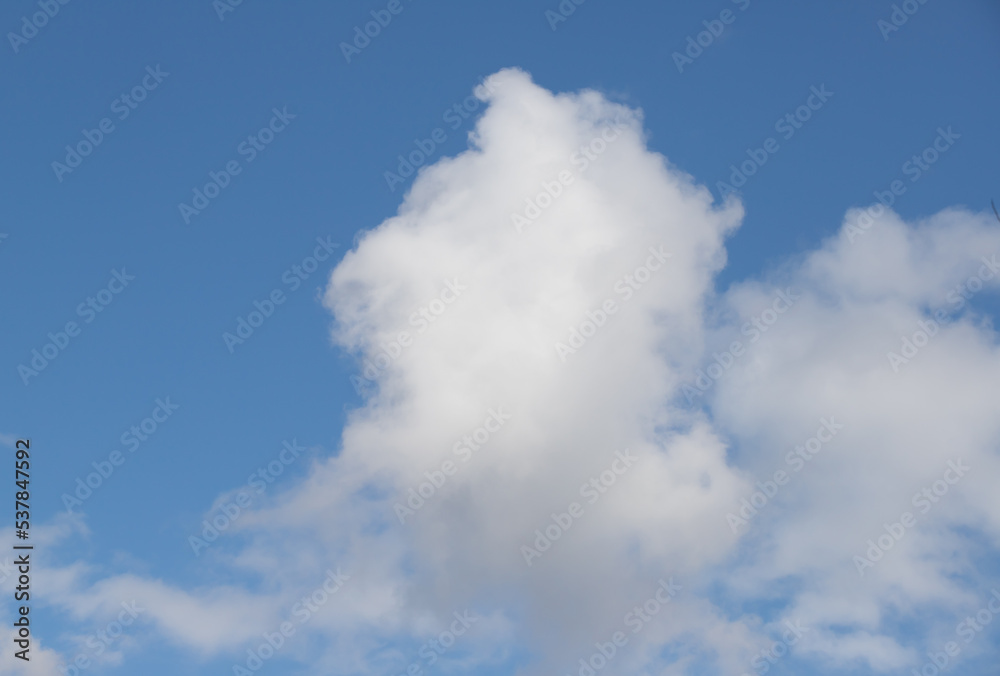Powerfully cumulus white clouds against a blue sky. Powerfully cumulus white clouds against a blue sky.