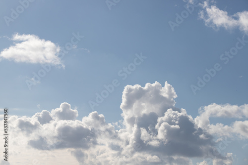 Powerfully cumulus white clouds against a blue sky.