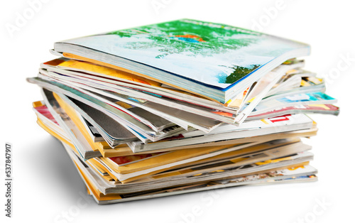 Stack of magazines on white background photo