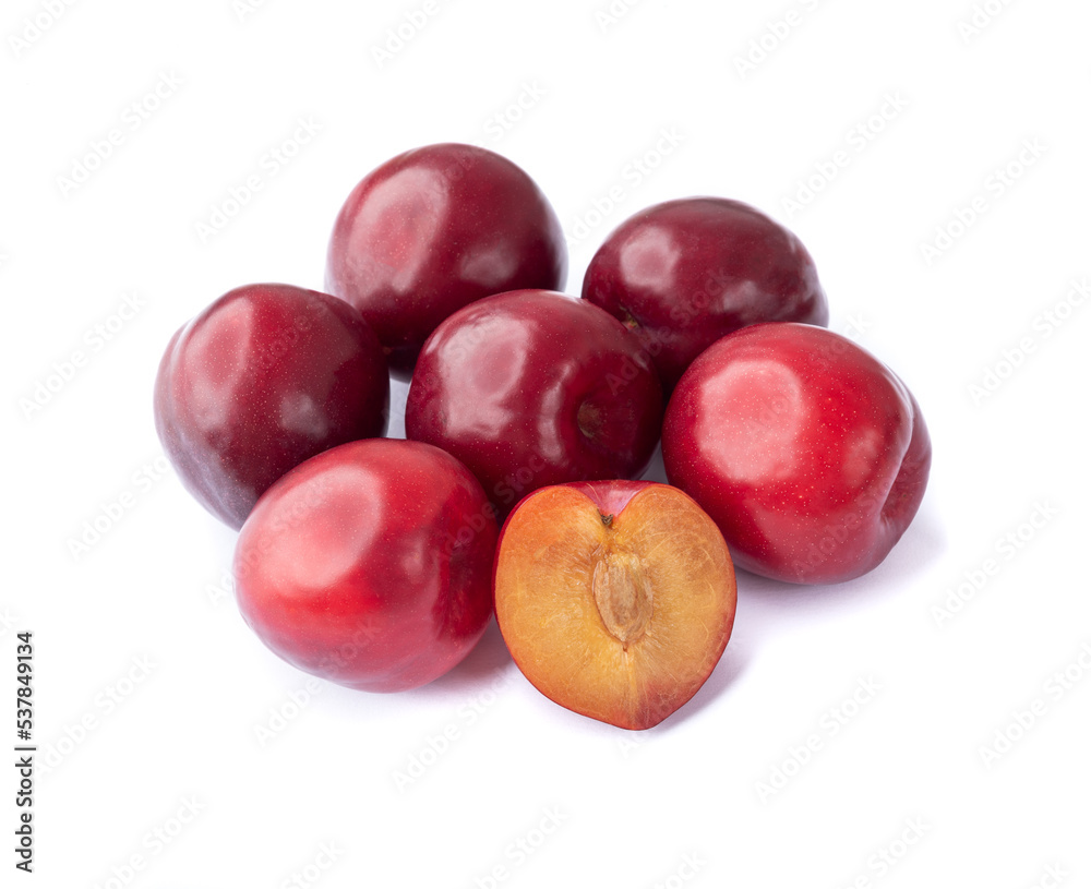 Plums with half fruit isolated over white background