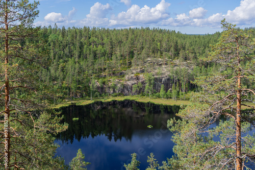 View from Hauklamminvuori Hill to the Hauklampi lake  rocks and forest in the Repovesi National Park on sunny summer day