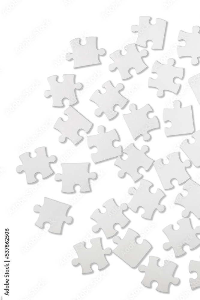 White puzzle pieces on grey background White puzzle pieces on grey background
