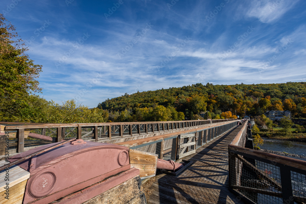 Historic Roebling Bridge also known as Roebling's Delaware Aqueduct over the Delaware River on a brilliant fall morning Historic Roebling Bridge also known as Roebling's Delaware Aqueduct over the Delaware River on a brilliant fall morning