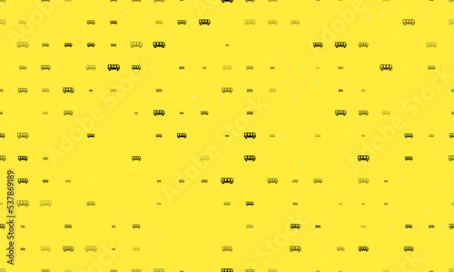 Seamless background pattern of evenly spaced black bus symbols of different sizes and opacity. Vector illustration on yellow background with stars