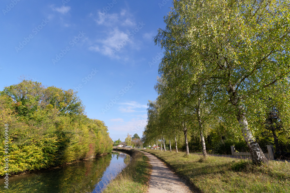Towpath along the Ourcq canal. Congis-sur-Thérouanne village in Île de France region Towpath along the Ourcq canal. Congis-sur-Thérouanne village in Île de France region