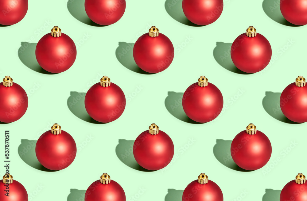 Pattern of christmas balls on green pastel background Pattern of christmas balls on green pastel background