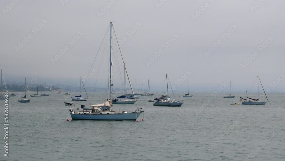 Sailboats standing in front of the coast of Santa Barbara, California, near Stearns Wharf. Sailboats standing in front of the coast of Santa Barbara, California, near Stearns Wharf.