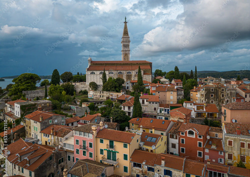 St. Euphemia church bell tower dominating the town of Rovinj surrounded by sea.