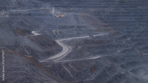 Stary Oskol, Russia - May 21, 2021: Quarry road and trucks photo