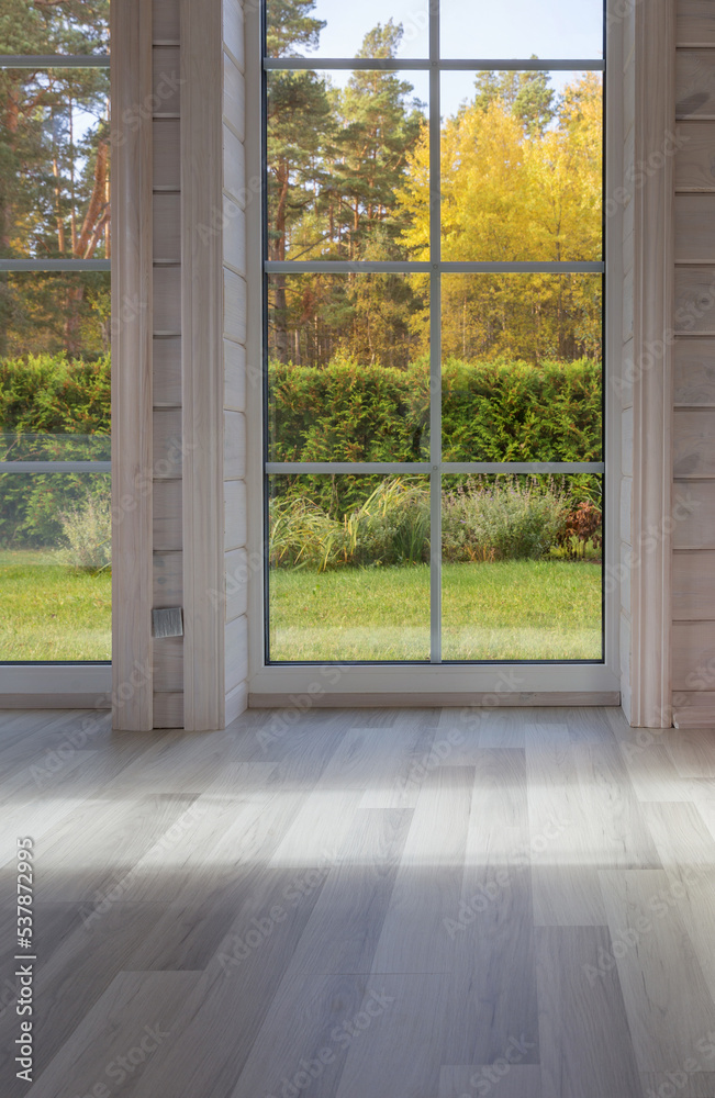 Fototapeta premium Bright photo studio interior with big window, high ceiling, white wooden floor