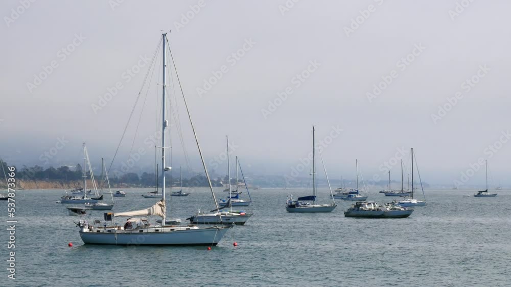 Sailboats standing in front of the coast of Santa Barbara, California, near Stearns Wharf. Sailboats standing in front of the coast of Santa Barbara, California, near Stearns Wharf.