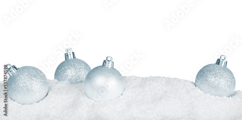 Silver shiny christmas balls in snow