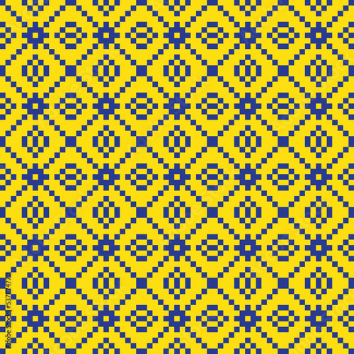 Blue cross-stitch knitting pattern on yellow background. Blue square dots on yellow backdrop. Fabric pattern design for sale. Knitting handicraft art.