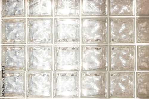 White glass brick wall - seamless texture. Close up photo