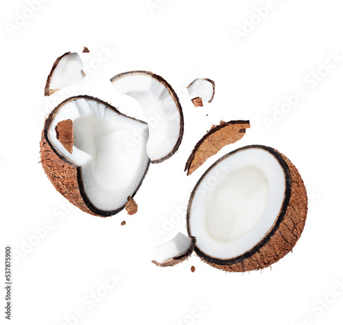 Crushed coconut close up in the air isolated on white background photo