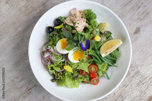 Salmon Salad Nicoise served in a dish isolated on grey background side view of salad