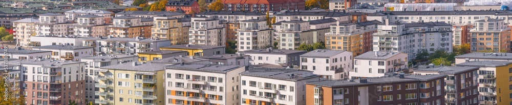 Modern apartment houses at the canal Hammarby Sjö a sunny a color full autumn day in Stockholm