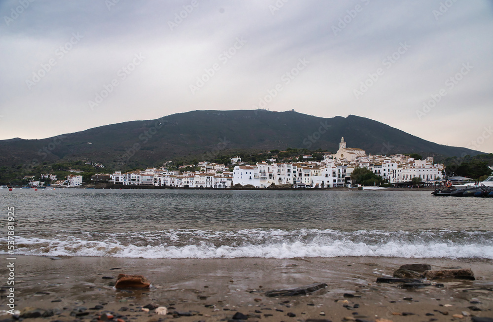 Seascape the village of Cadaqués, near Barcelona. Picturesque old town with a beautiful beach. Isolated fishing village in the mountains. Famous tourist destination on the Costa Brava with the landmar