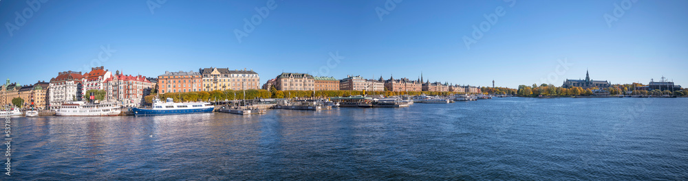 Hotel and office houses at the street Strandvägen in the bay Nybroviken a sunny a color full autumn day in Stockholm