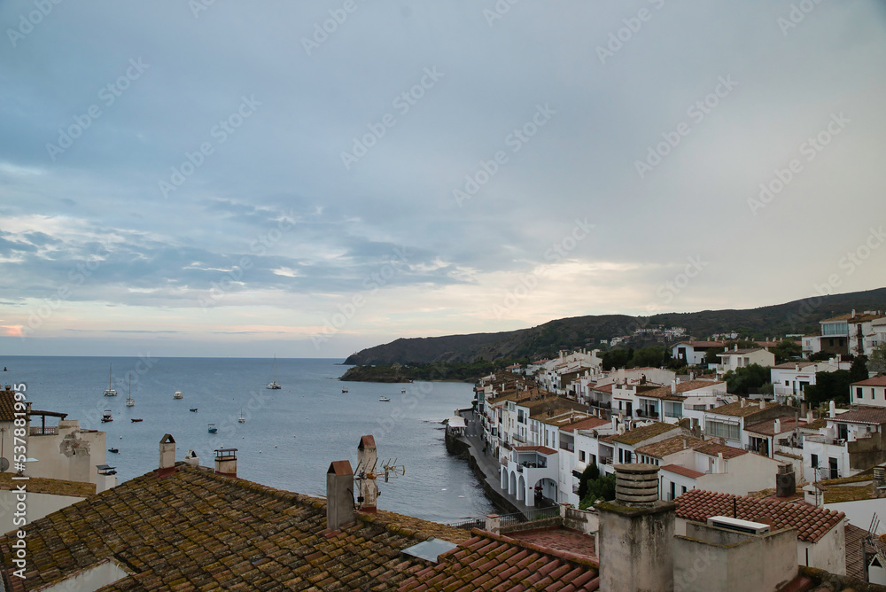 Seascape the village of Cadaqués, near Barcelona. Picturesque old town with a beautiful beach. Isolated fishing village in the mountains. Famous tourist destination on the Costa Brava with the landmar