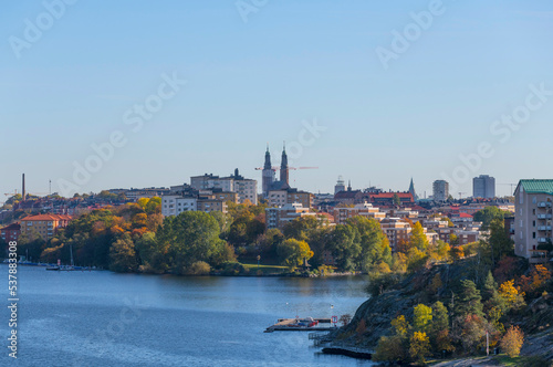 Apartment houses and church spires on the islands Reimers Holme and S  dermalm a color full autumn day in Stockholm
