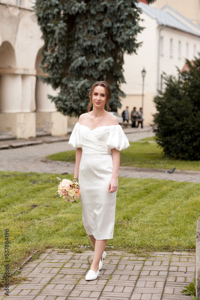 Beautiful bride with big wedding bouquet Beautiful bride with big wedding bouquet