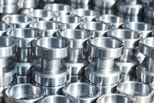 Metal products turned on a CNC lathe, close-up.