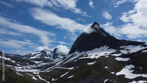 Beautiful shot of a landscape with tall mountains in Urke, Norway photo