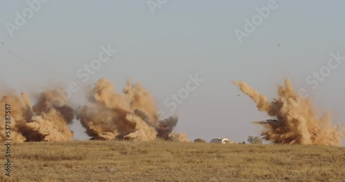 Slow motion of Airstrike with bombs hitting targets with smoke and explosions