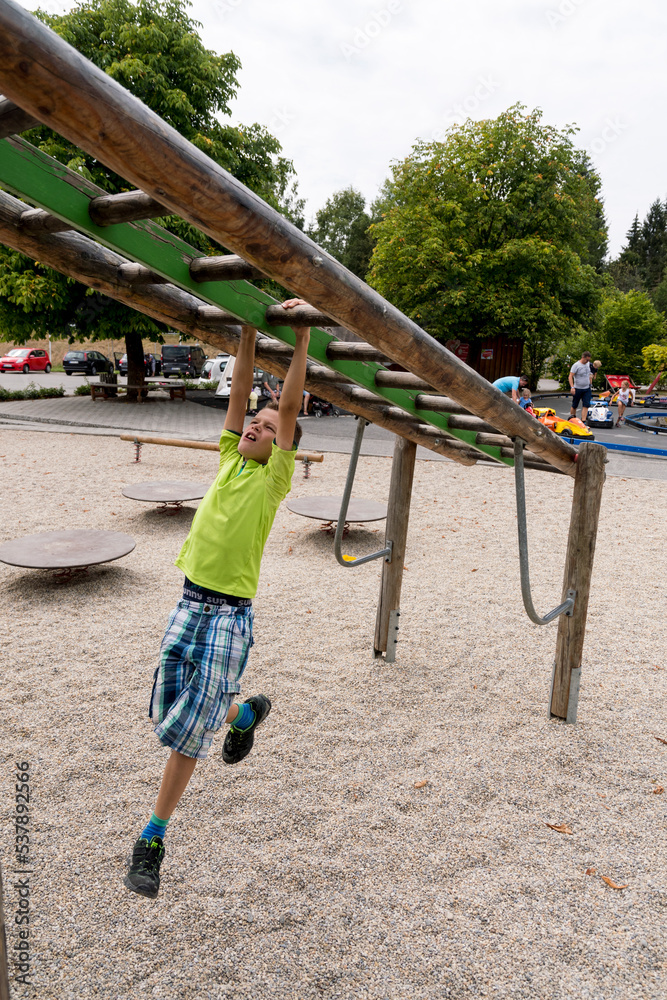 Fototapeta premium child playing on a swing