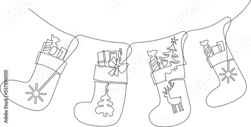 Christmas socks for gifts hang on a rope. Traditional decoration of the house for the new year. Continuous line drawing, vector illustration.