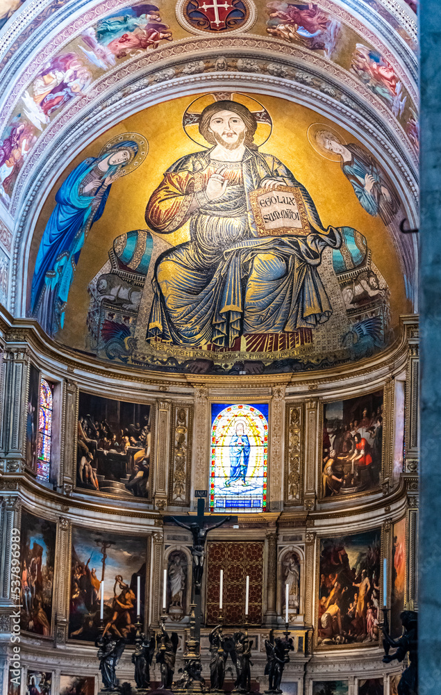 Beautiful golden fresco decorating altar inside catholic basilica in Pisa