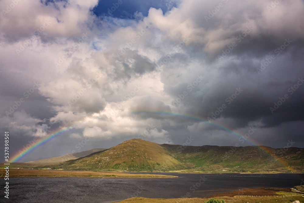 Obraz premium Rainbow over Claggan Mountain on Blacksod Bay, County Mayo Ireland