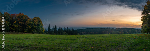 Pasture land and meadow near Marianske Lazne spa town in evening