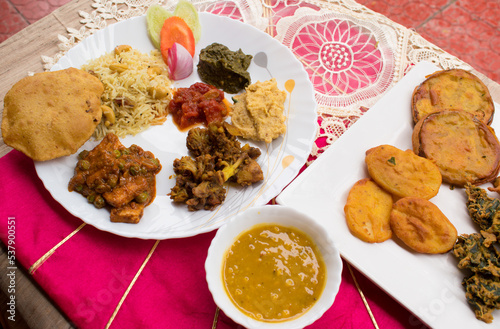 Chhath puja or maha parv paran Thali contain pulav, dal, tarua, oal tomato chutney, saag, puri, pakoda, sabzi. Popular festival in bihar jharkhand. Bihari food. photo