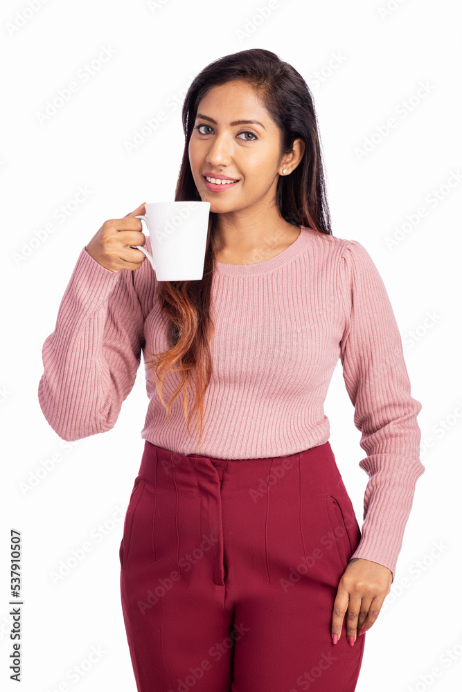 Young woman holding tea cup isolated on white. Young woman holding tea cup isolated on white.