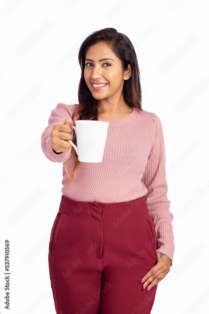Young woman holding tea cup isolated on white. Young woman holding tea cup isolated on white.