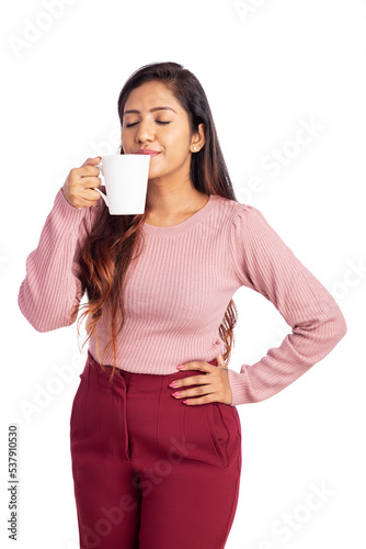 Pretty young woman enjoying fragrance of coffee isolated on white.
