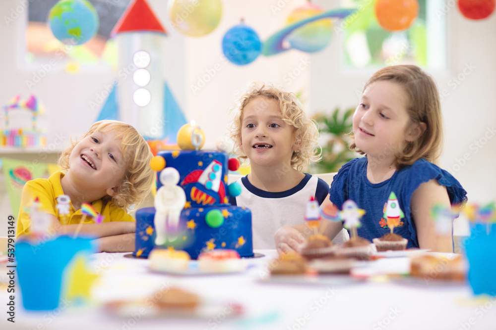 Fototapeta premium Kids space theme birthday party with cake.