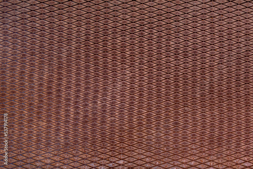 Texture of old rusty grungy metal sheet. Uneven aged rough bumpy surface. Corrugated painted wall of smudged iron. Rusted hard pitted retro garage door. Vintage dirty destroyed roof for grunge design