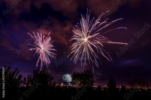 Fireworks glowing in a night sky on 4th of July in Great Falls, Montana photo